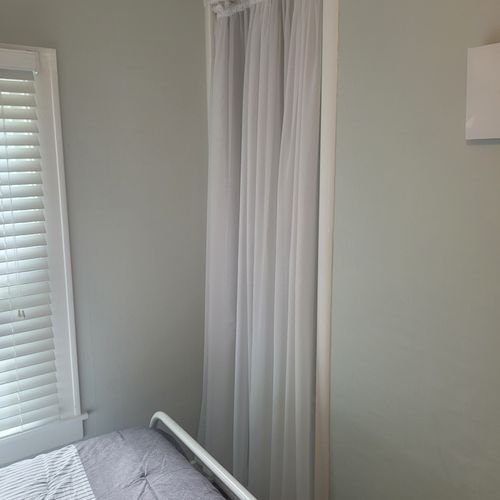 BEDROOM #2:  Features a full-size bed, dresser, lamp, mirror, and closet.