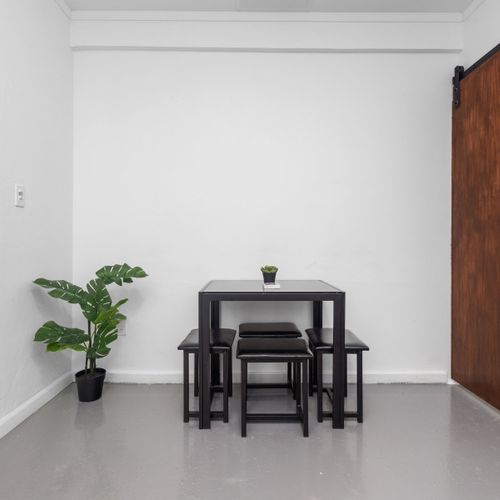 Chic Airbnb kitchen featuring wooden countertops and stainless steel appliances.