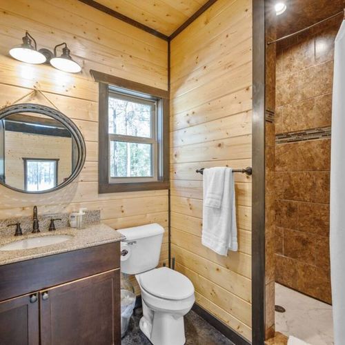 Full bathroom for the game house with a walk-in shower.