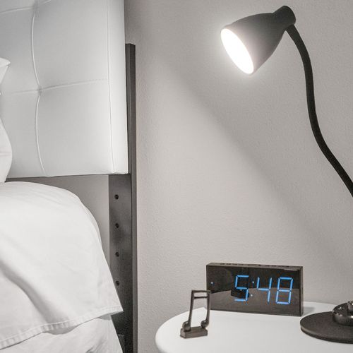 Bedside lamp for easy late-night reading without disturbing the room.