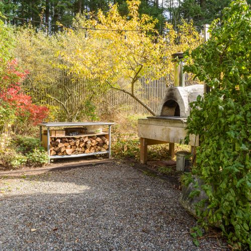 Soak up sunny days on the spacious deck, then gather in the garden for pizza nights under the trees.