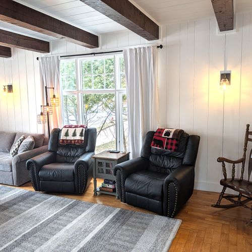 LIVING ROOM (MAIN FLOOR):  Gorgeous main floor living room with a large live streaming television, gas fireplace, and lots of seating!