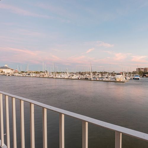 Rear-facing balcony off of master bedroom with view of Southern Yacht Club and the Lake Pontchartrain Marina.