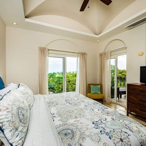 The master BDR has a kibd bed, nice bed linens and a personal TV screen