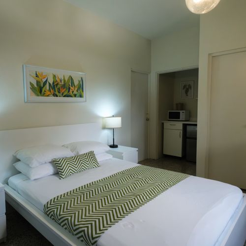 "Self-Contained Comfort: Experience the best of both worlds – a cozy queen bedroom and the practicality of a small kitchenette, offering you independence and convenience.