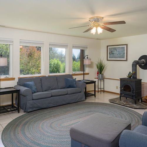 You'll enter the home from the lower, second  living room.