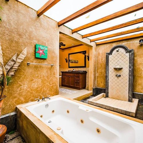 The bathroom has an outdoor shower and tub.