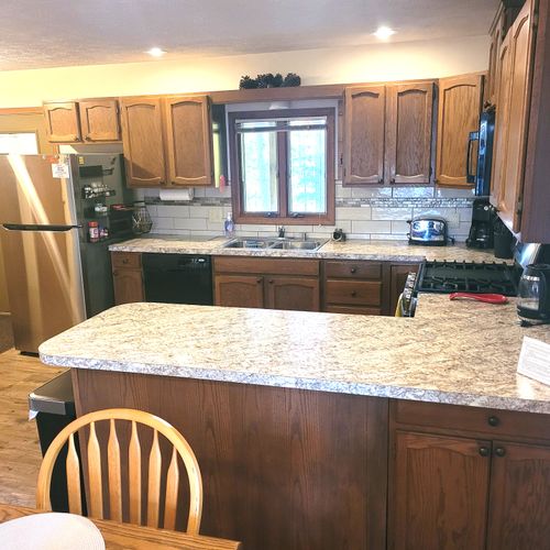 KITCHEN:  The home has a large and modern kitchen with all appliances including a dishwasher.  A good supply of cooking and dining utensils is also included.
