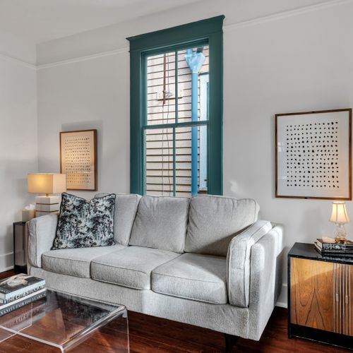 Bright, welcoming living room w/ cozy seating & beautiful natural light.