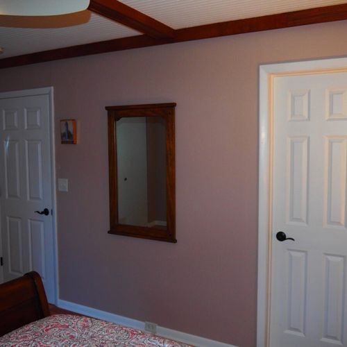 Bedroom #1 (second floor):  features a queen-size bed, nightstands, dresser, ceiling fan, closet, and a private entrance to the second floor bathroom.