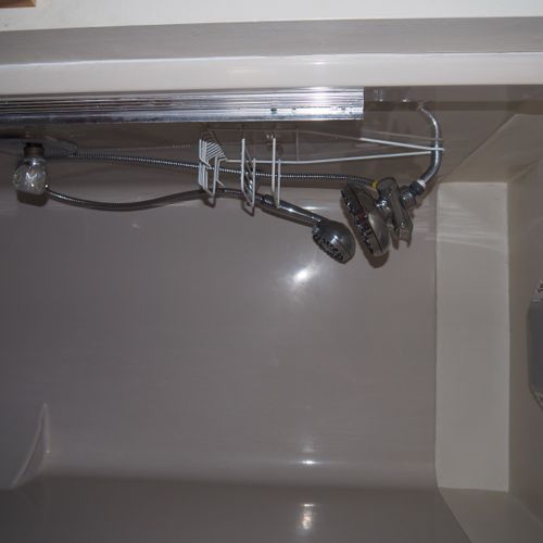 Bathroom:  small, but full bathroom, with entrance from the living room. Includes sink, mirror, toilet, and shower.