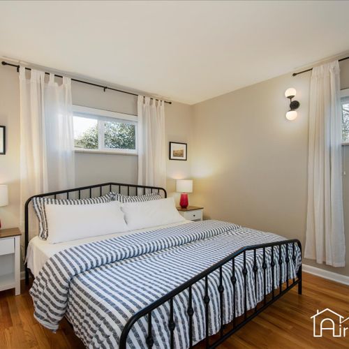 There is a charming master suite with a king bed, a widescreen roku tv, and an ensuite bath.