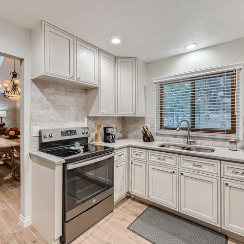 The kitchen connects directly to the dining room area and is fully equipped for you to whip up any gourmet meal.