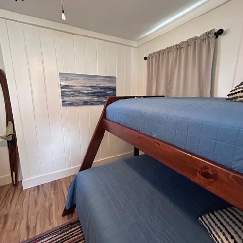 Bedroom #2:  features a twin-on-full bunk bed, ceiling fan, and dresser.