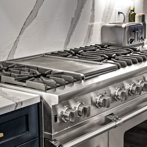 A full-size fridge, oven, microwave, and dishwasher are all included.