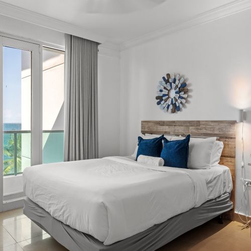Immerse yourself in coastal charm with this beautifully decorated bedroom, offering two spacious beds and magnificent sea views, making every moment of your stay unforgettable.