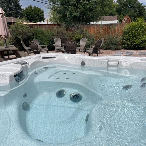 Relaxing in clear hot tub waters.