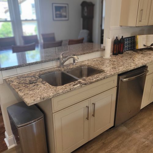 Kitchen:  the home has a newly-renovated kitchen with a large kitchen island and all appliances, including a dishwasher. There is also a good supply of cooking and dining utensils provided.