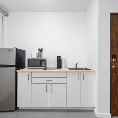Chef's Delight: Prepare delicious meals in this inviting and fully-equipped kitchen, featuring ample counter space and modern appliances for your culinary adventures.
