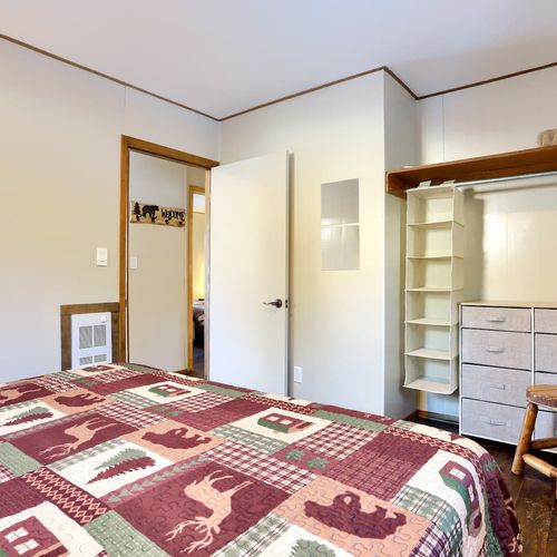 - spacious open closet with drawers & shelves offers room for all your mountain gear
- convenient layout keeps everything organized with modern simplicity & rustic charm
- natural light & forest themed bedding complete your restful mountain retreat