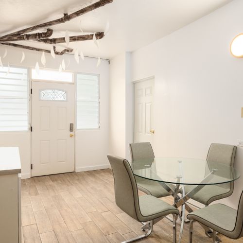 Bright & airy interior with dining area.