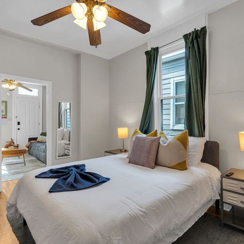 Sun-filled bedroom w/ plush pillows & a breezy, relaxed feel.