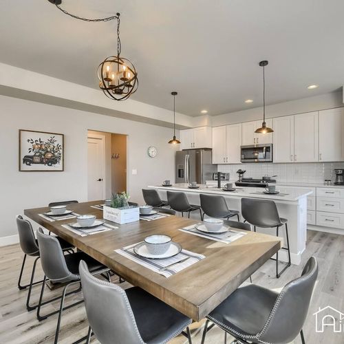 This bright and airy dining room is the perfect spot for dinner parties and family meals. The neutral tones and natural light create a warm atmosphere that is ideal for entertaining.