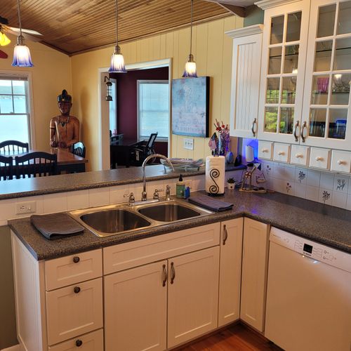 KITCHEN (SECOND FLOOR):  The home has a large kitchen with all appliances including a dishwasher.  Also includes a good supply of cooking and dining utensils.