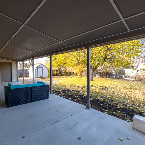 Savor the crisp fresh air in comfort while the kids and pups run around the green space.