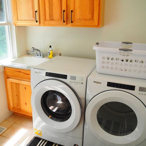 Laundry room:  great laundry room at the back of the house next to the back door! Includes a front-load washer and dryer and a laundry sink.
