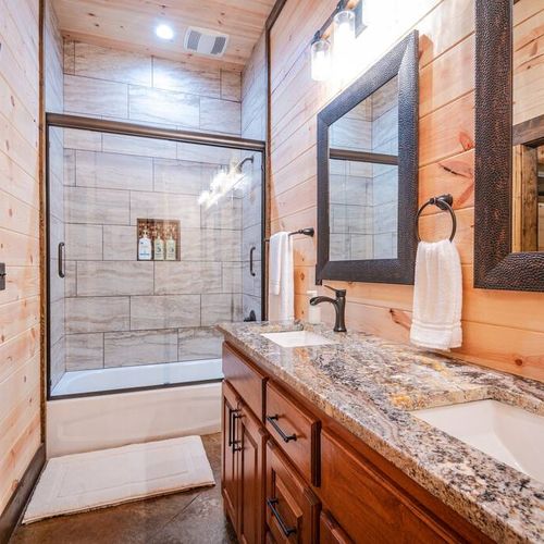 Equipped with a shower/tub combo.