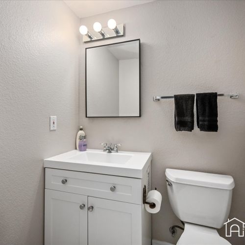Freshen up at the conveniently located half bath.