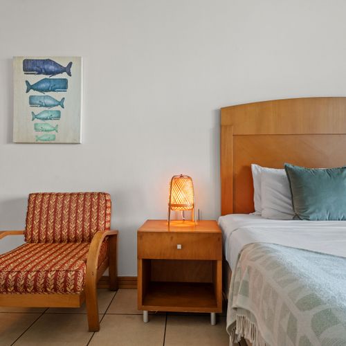 Your personal window to paradise. This perfectly framed view captures the essence of Condado Lagoon living, offering a constant connection to the waterfront from your spacious bedroom.