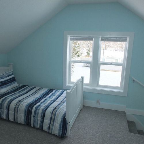 Upstairs living room:  another angle, showing the large windows that face east.