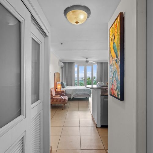 Sleep with a view. Enjoy unparalleled lagoon and ocean panoramas right from your bed, complemented by modern comforts like AC and a ceiling fan for a perfect night's rest.