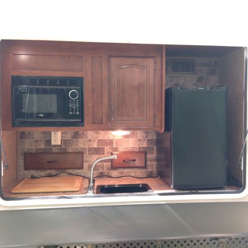 Exterior:  the cute little outdoor kitchen that is included.