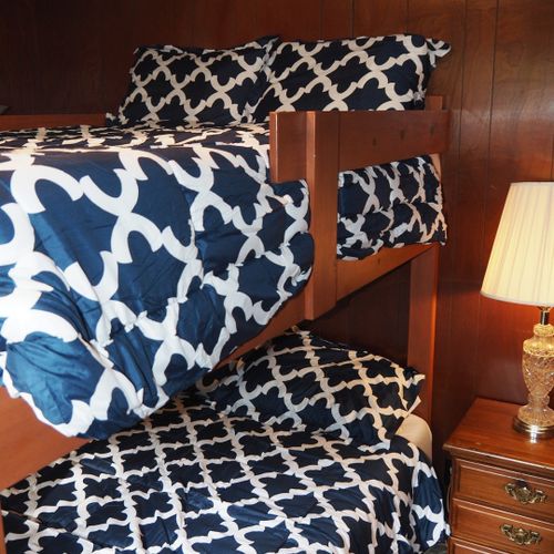 Bedroom #2:  features a full-on-full bunk bed, dresser, closet, and lamps.