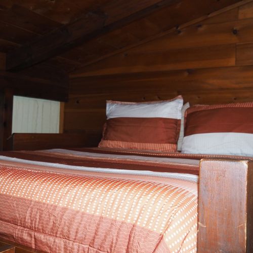 Bedroom #2:  features a full-on-full bunk bed, dresser, closet, and chair.