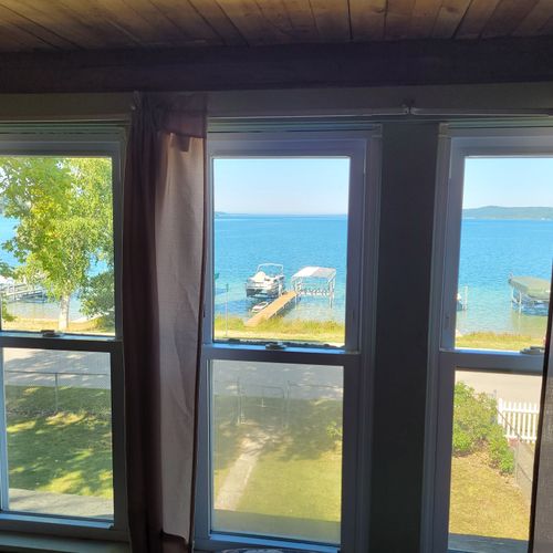 BEDROOM #4 (UPPER FLOOR):  Features two full-size beds, a dresser, closet, and a great view of Crystal Lake!