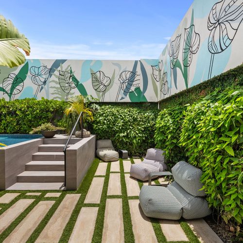 Relax outdoors in style by the beautiful pool area.