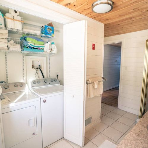 Guest bathroom with shower and washer and dryer