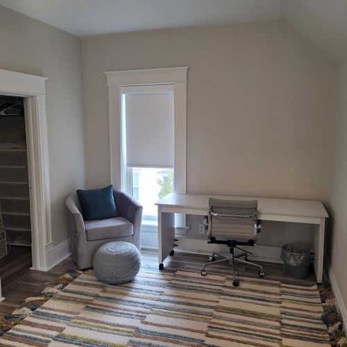 Bedroom #3 (second floor):  features a queen-size murphy bed, window a/c unit, ceiling fan, desk with chair, comfy chair, and a closet.