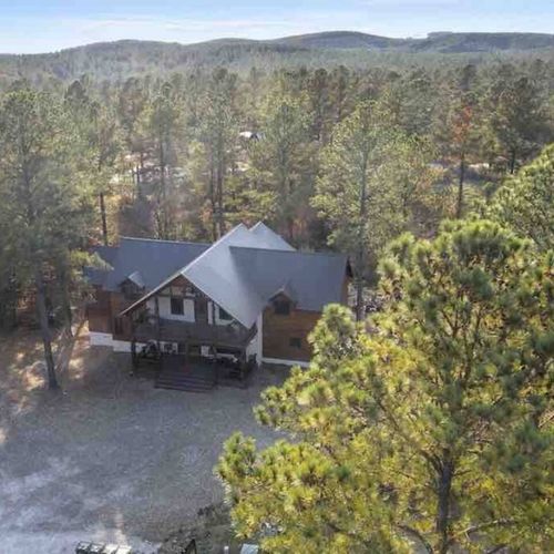The pines stand tall around Yellowstone Lodge.