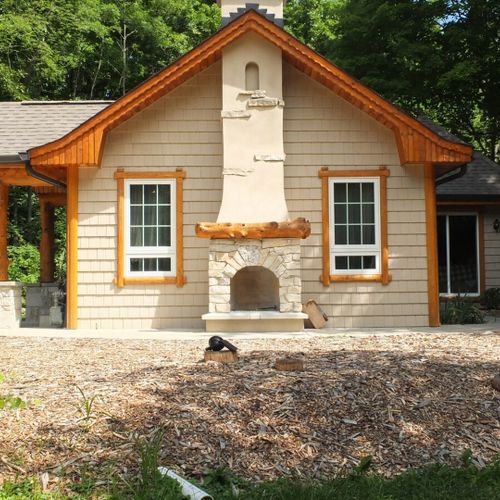 Exterior:  the side of the house. At the back of the house, the sliding doors to bedroom #1 are visible as well.