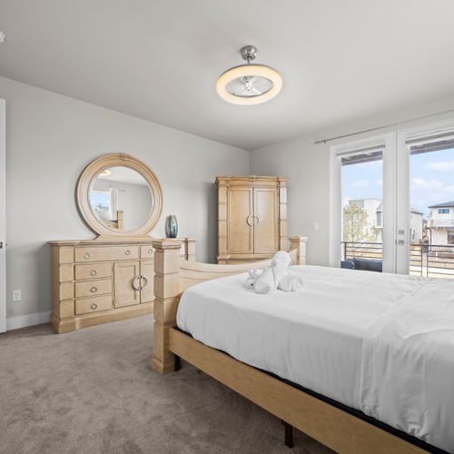 Spacious primary suite with views and blackout shades.