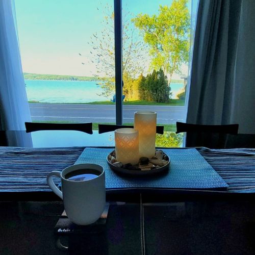Dining room:  between the kitchen and the living room is a very nice dining area with a table and chairs for 6 along with a great view of crystal lake!