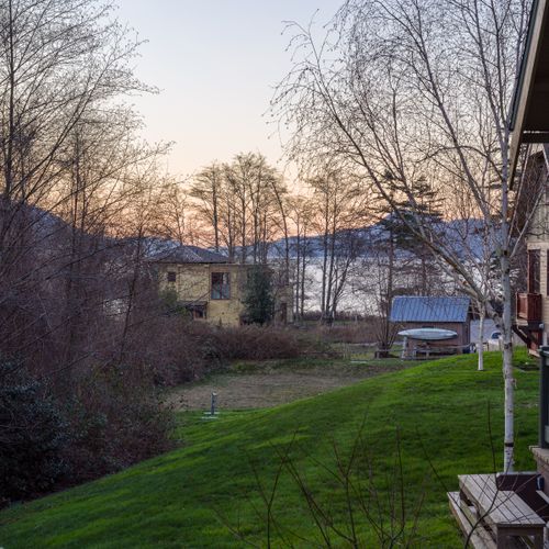 Gently sloping lawn with scenic neighborhood views.