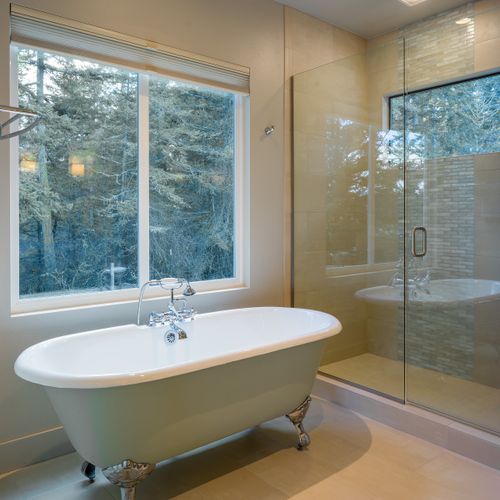 Main Suite private bath with radiant floor heat, double vanities, walk-in shower, and water closet.  Natural shampoo, conditioner, soaps, and quality towels are provided.