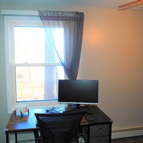 Bedroom #2 (main floor):  includes a futon, workstation (desk, chair, and monitor), ceiling fan, closet, and another lovely lake view!