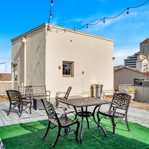 Rooftop terrace w/ patio seating — the perfect spot to soak in the city.